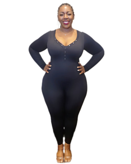 Woman wearing a dark blue bodysuit on a white background