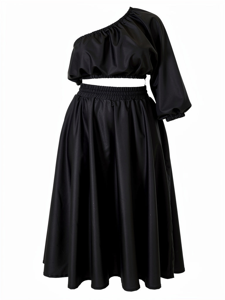 Black one-shoulder top and skirt set on a white background