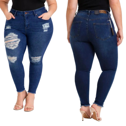 A side-by-side view of a model wearing plus-size dark blue distressed skinny jeans, showing both the front and back. The model is wearing a black top and beige high-heeled sandals against a plain white background.