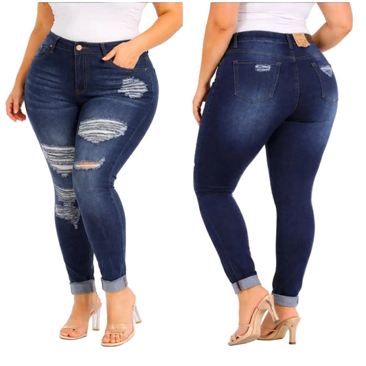 Plus-size dark blue distressed skinny jeans shown on a model from the front and back, paired with a white top and beige high-heeled sandals against a white background.