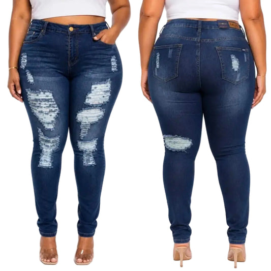 A side-by-side front and back view of a model wearing dark blue distressed skinny jeans with ripped details on the thighs and knees, paired with a white crop top and clear high-heeled sandals.