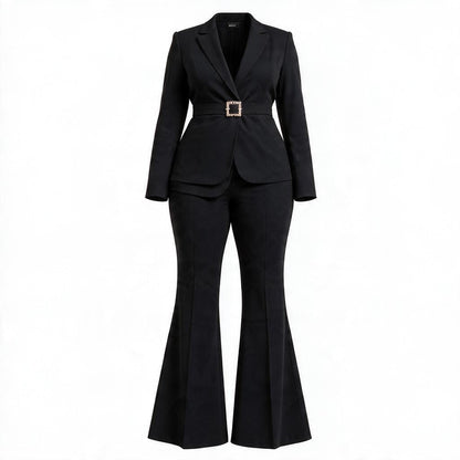 A black two-piece suit featuring a long-sleeve blazer with a structured waist and a decorative gold-tone square buckle, paired with matching flared trousers, shown on a plain white background.