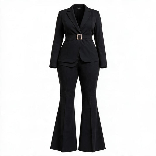 A black two-piece suit featuring a long-sleeve blazer with a structured waist and a decorative gold-tone square buckle, paired with matching flared trousers, shown on a plain white background.