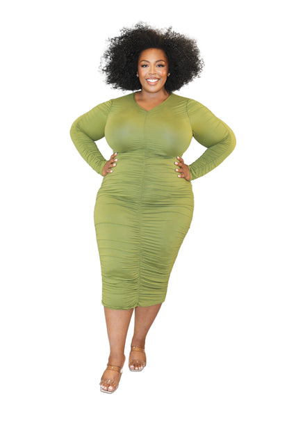 Woman wearing a green dress against a white background