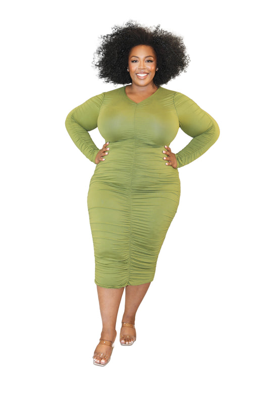 Woman wearing a green dress against a white background