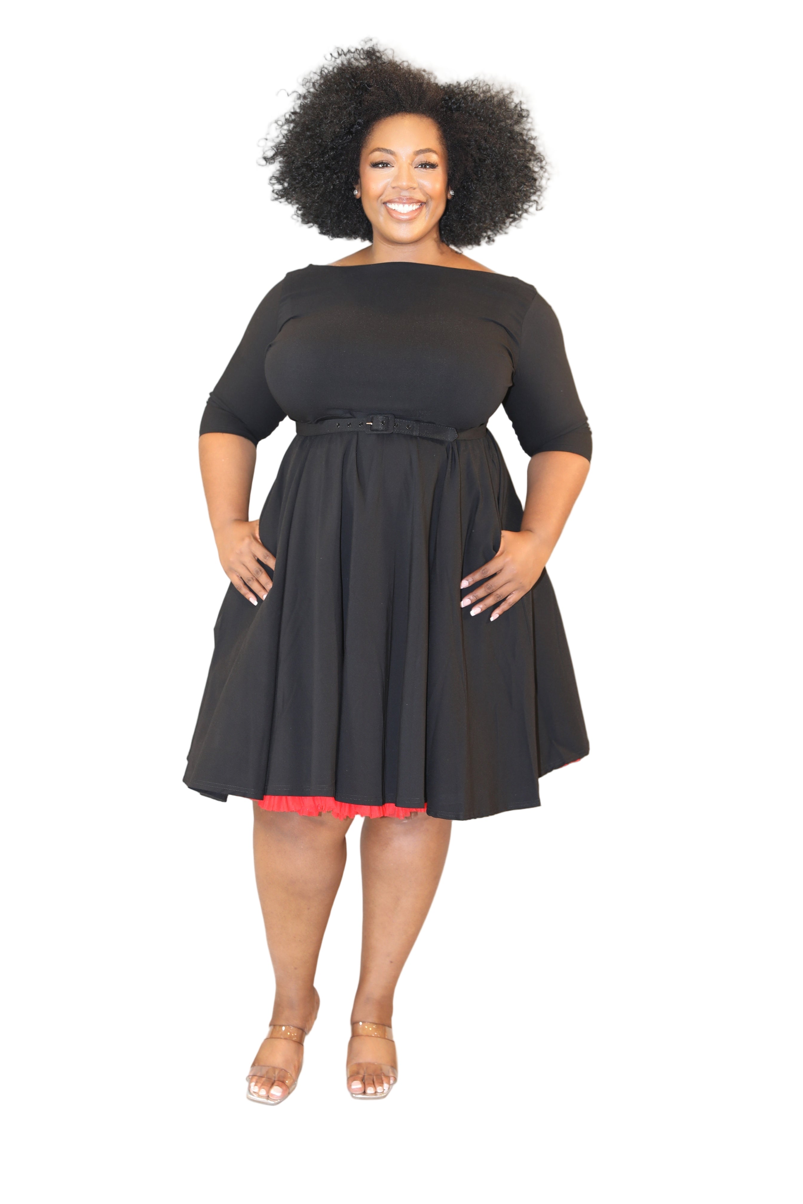 Plus Size woman wearing a Black swing dress with red under tutu