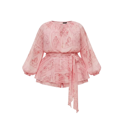 Pink romper with long sleeves on a white background