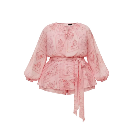 Pink romper with long sleeves on a white background