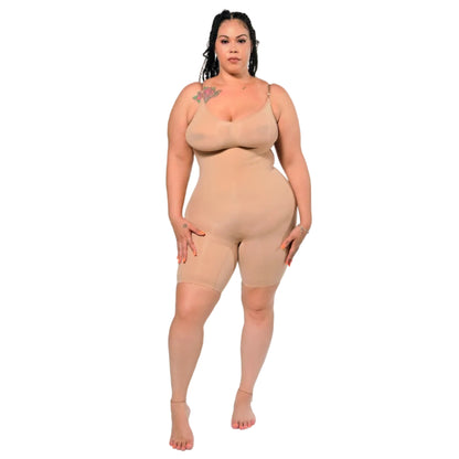 Woman wearing a beige shapewear bodysuit on a white background (front)