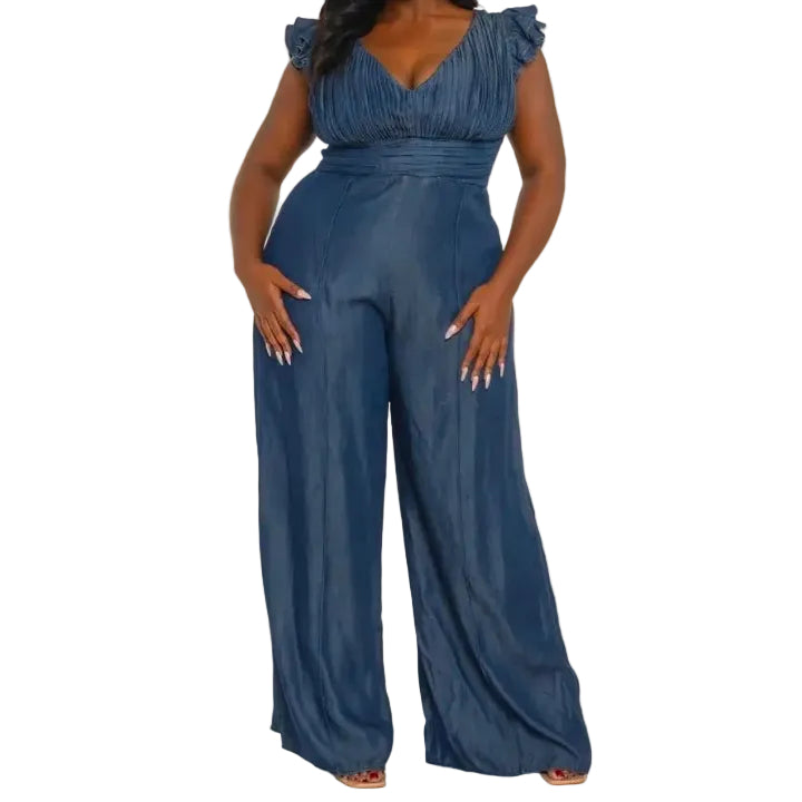 Woman wearing a denim jumpsuit on a white background. (front)