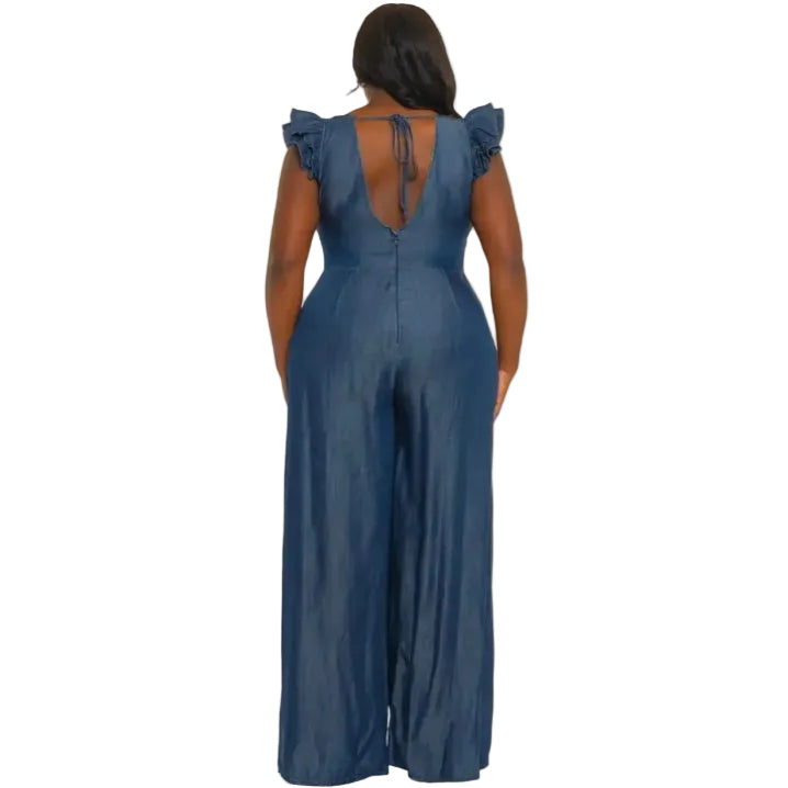 Woman wearing a denim jumpsuit on a white background. (back)