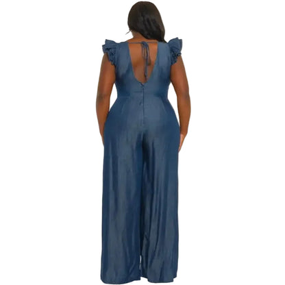 Woman wearing a denim jumpsuit on a white background. (back)