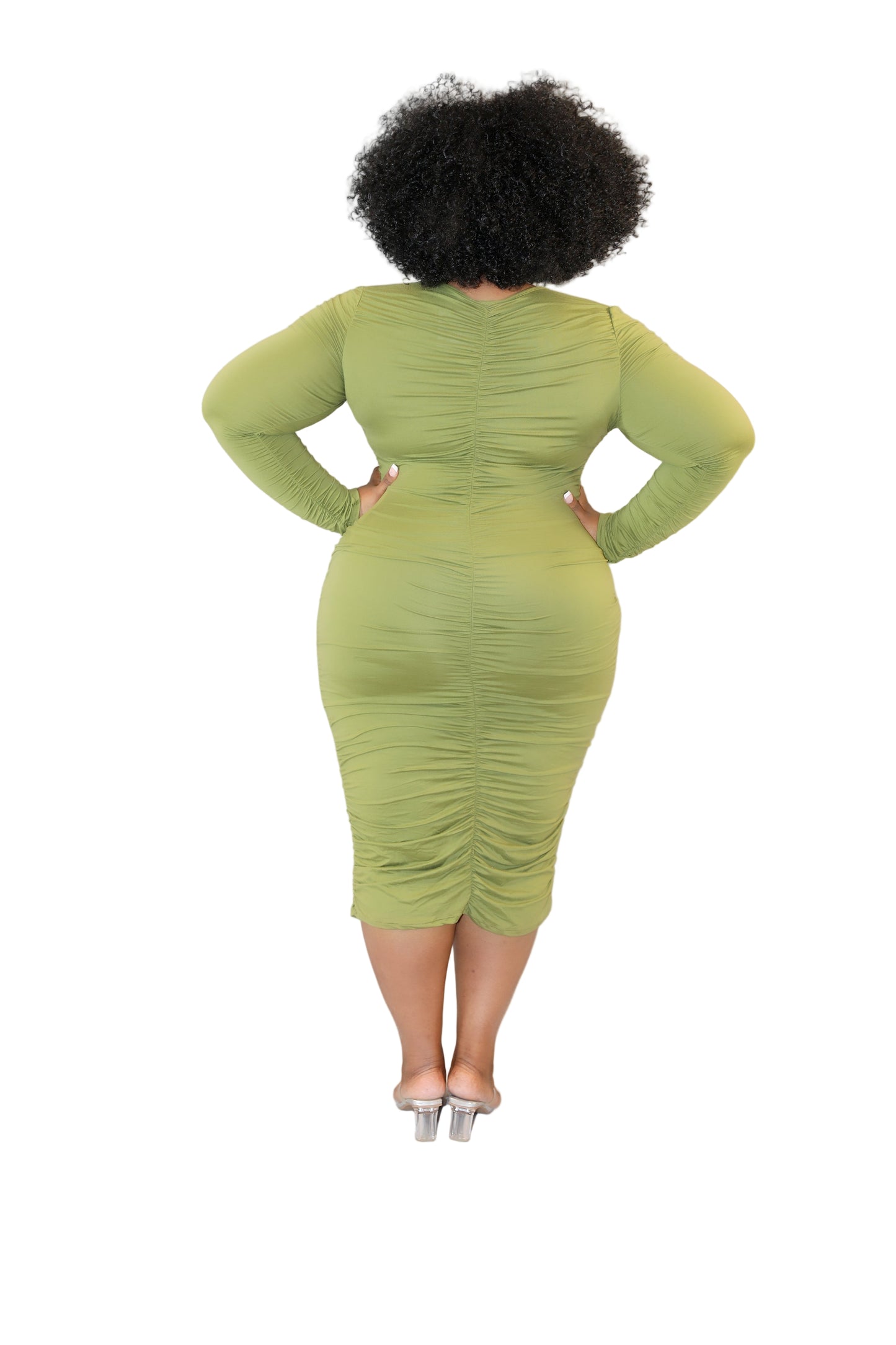 Woman wearing a green dress against a white background (back)