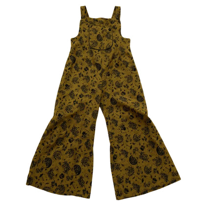 Mushroom patterned overalls on a white background