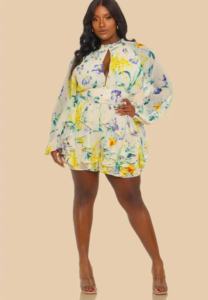 Woman wearing a floral romper on a beige background (front)