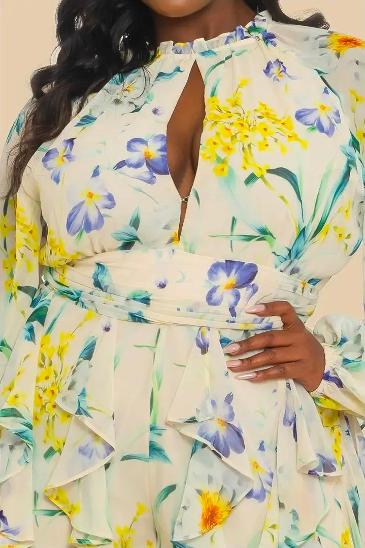 Woman wearing a floral romper on a beige background (closeup, front)