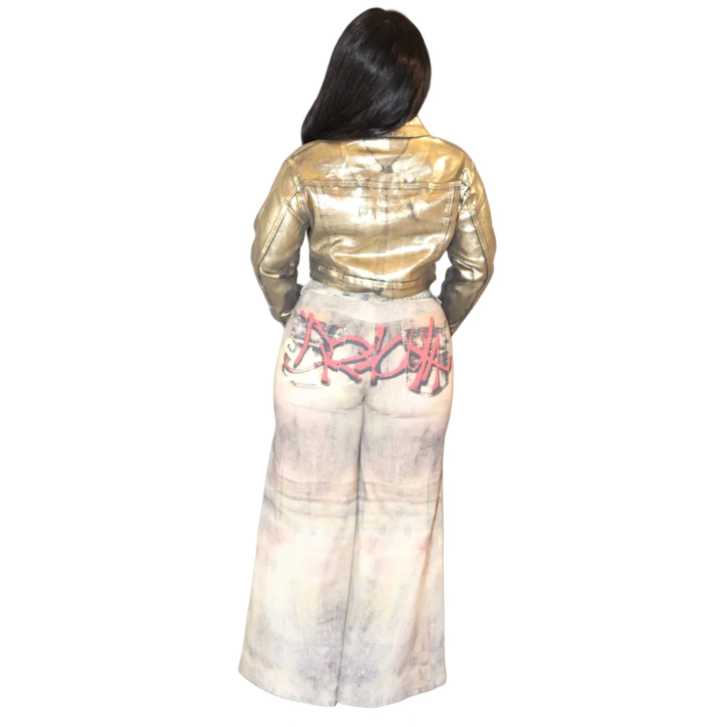 Woman wearing a gold jacket and light colored jeans on a white background. The jeans are detailed with multicolored graffiti. (back)