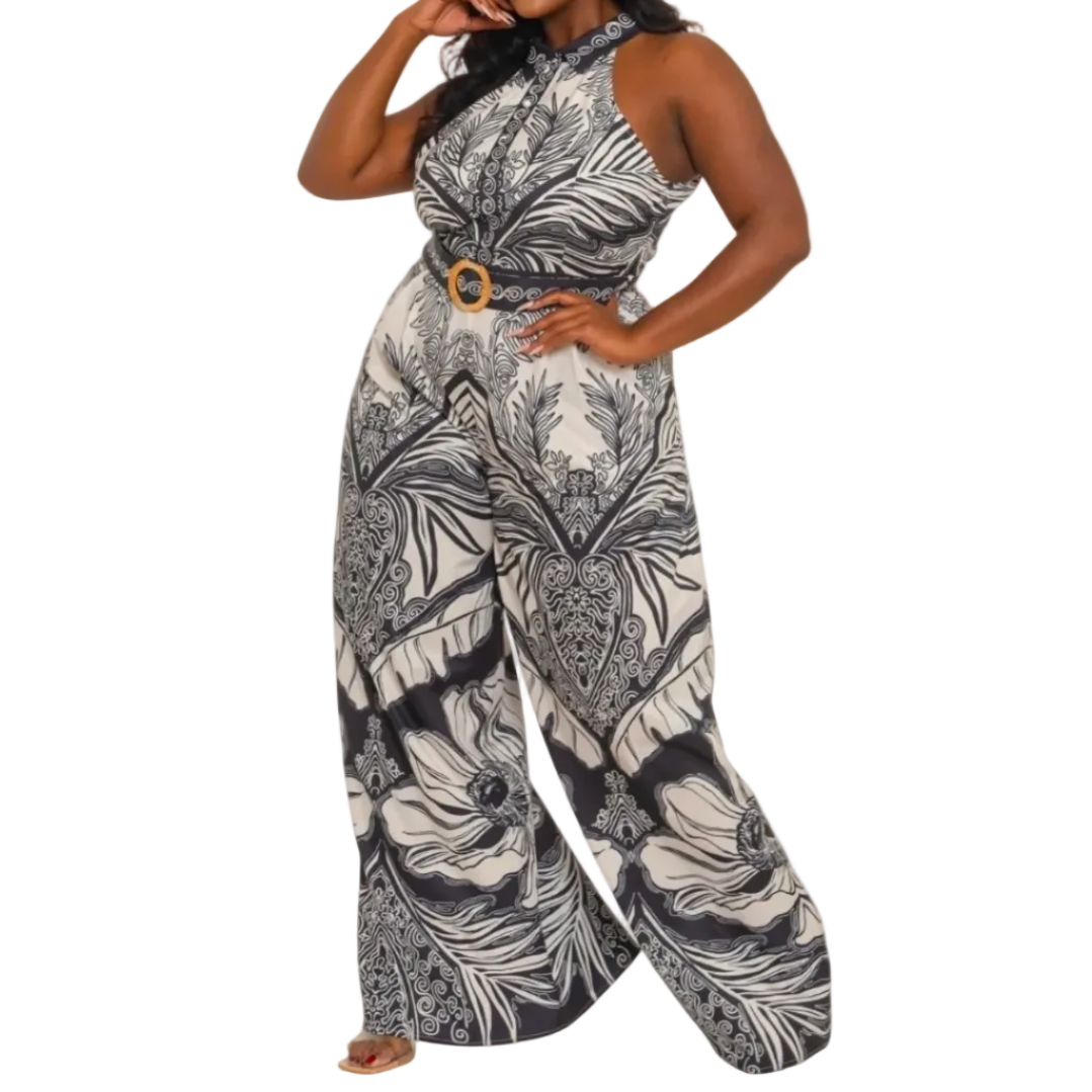 Woman wearing a black and white patterned jumpsuit on a white  background (front)