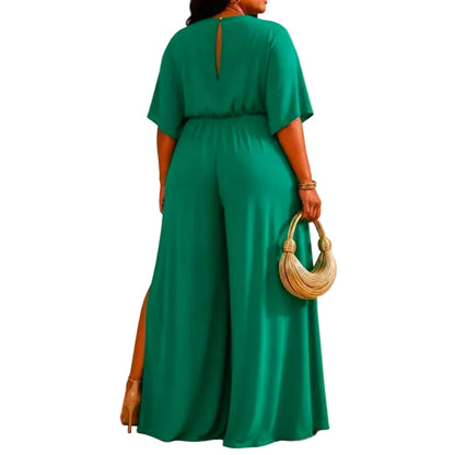 Woman wearing a green jumpsuit with a white background (back)