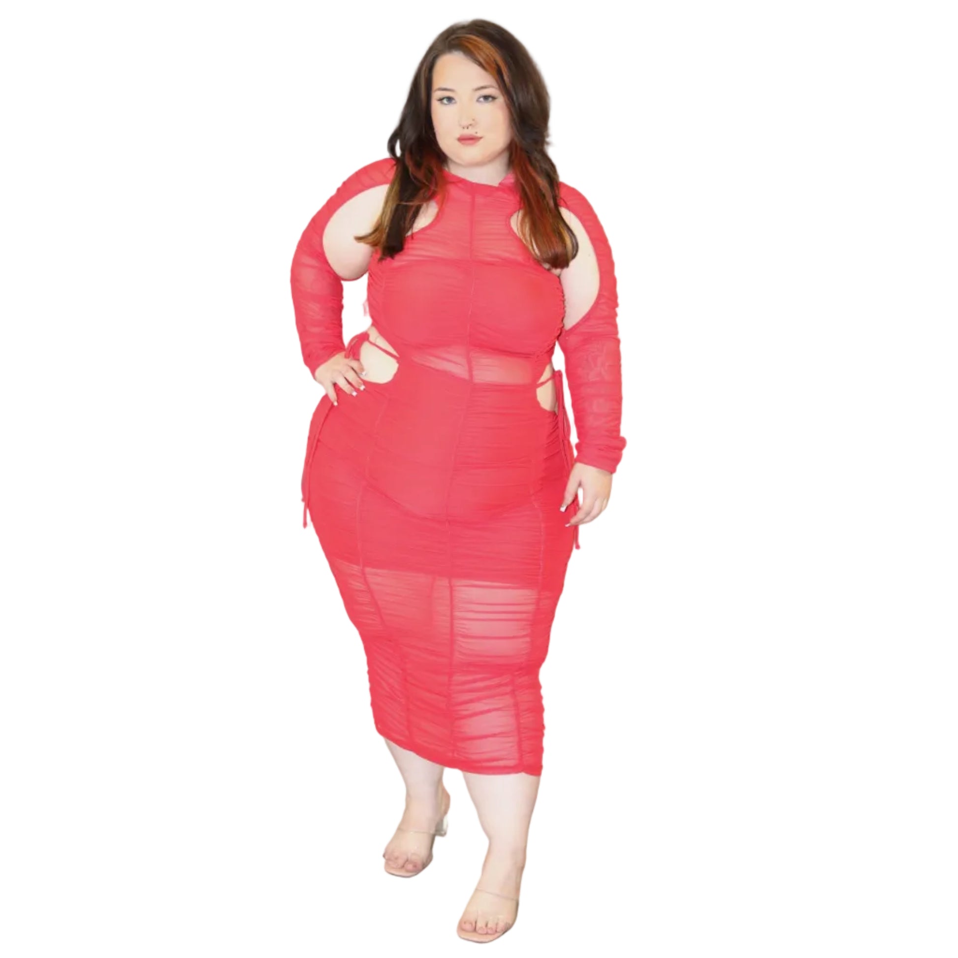 Woman wearing a red sheer dress with cutouts on a white background (front)