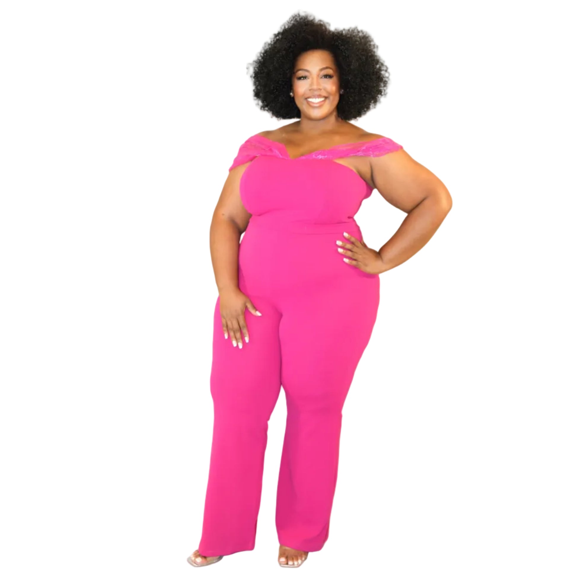 Woman wearing a bright pink jumpsuit with sheer off-the-shoulder sleeves on a white background. (front)