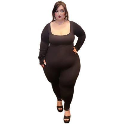 Woman wearing a long-sleeve catsuit on a white background.