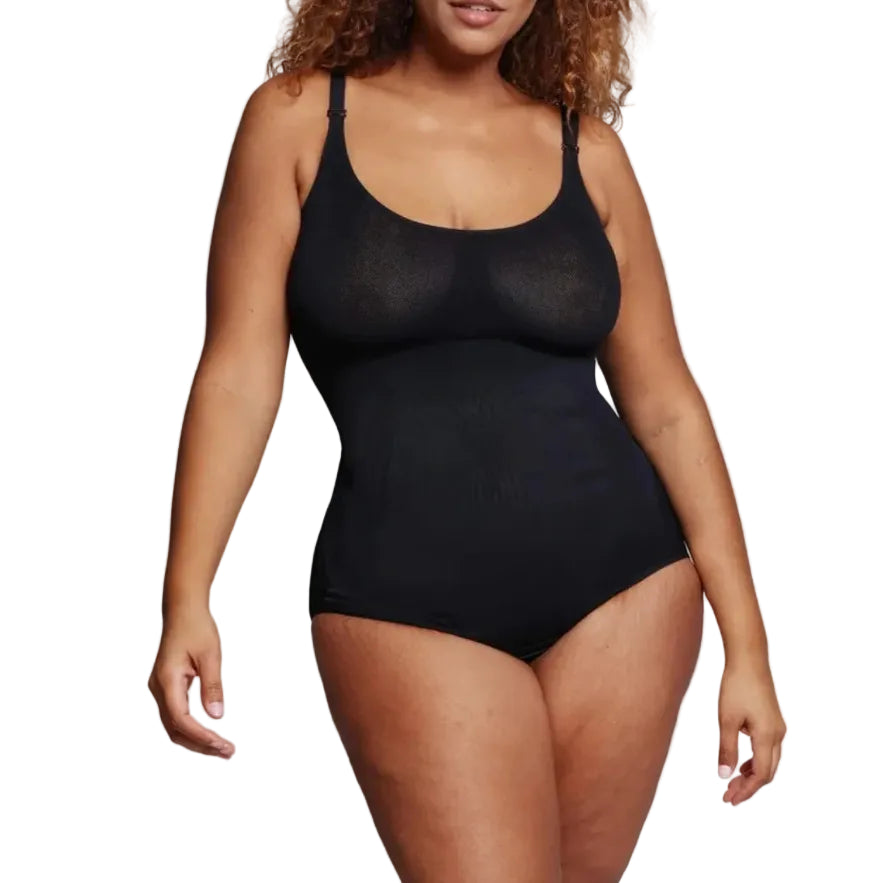 Woman wearing a black bodysuit against a white background. (front)