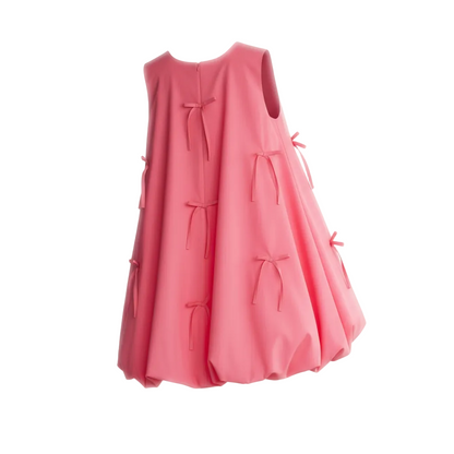 Pink dress with bow details on a white background