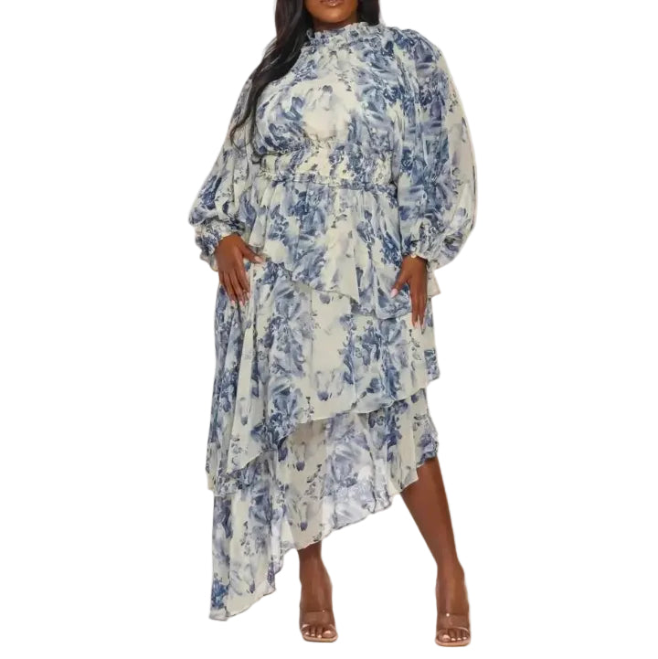 Woman wearing a blue and white floral maxi-dress on a white background