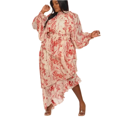Woman wearing a red and white floral maxi-dress on a white background.