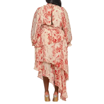Woman wearing a red and white floral maxi-dress on a white background. Rear view.
