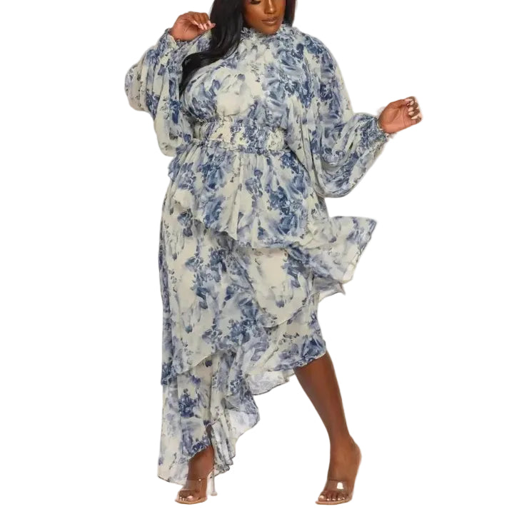 Woman wearing a blue and white floral maxi-dress on a white background
