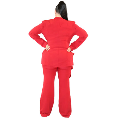 Woman wearing a red suit against a plain background with her hands on her hips (back)
