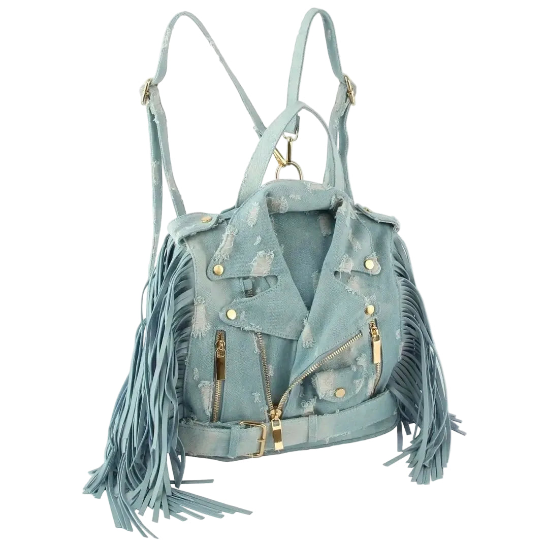 Light blue denim bag with backpack straps, a handle, fringe, and gold hardware on a white background. (angled)