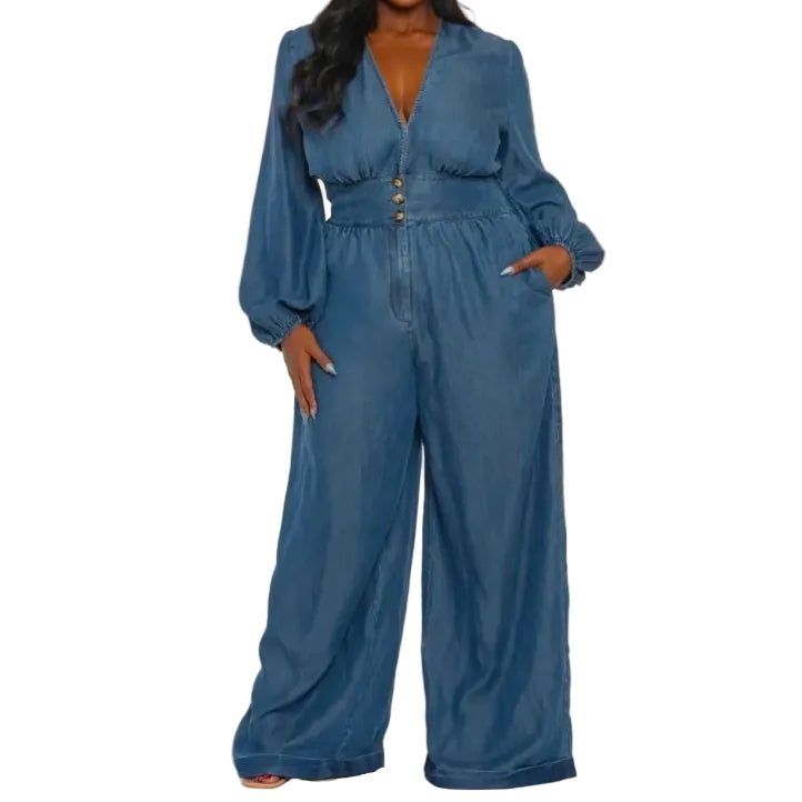 Woman wearing a blue denim jumpsuit on a white background