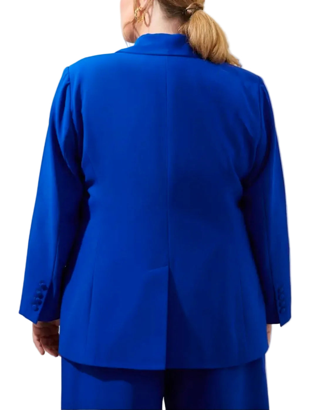 A woman shown from the back wearing a bright royal blue tailored blazer and matching trousers against a plain light gray studio background.