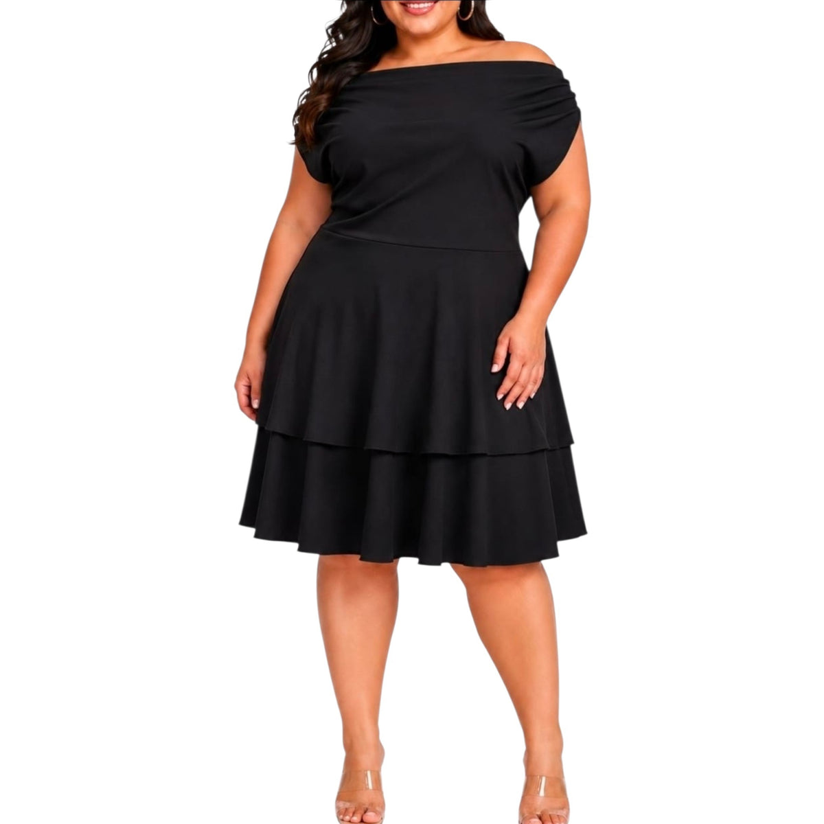 A woman modeling a black off-the-shoulder tiered dress with a fitted waist and flared skirt, shown against a plain white background.