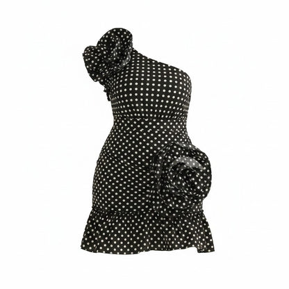 Black polka dot dress on a white background