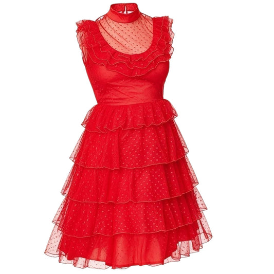A sleeveless red dress with a high mock neck, sheer polka-dot mesh overlay at the neckline and bodice, and a tiered ruffled tulle skirt on a plain white background.