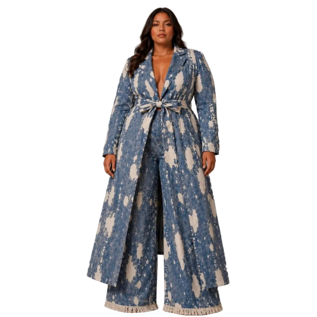 Woman modeling a long blue and beige abstract patterned coat with matching wide-leg pants, featuring a tie belt at the waist and fringed hems, shown against a plain white background.